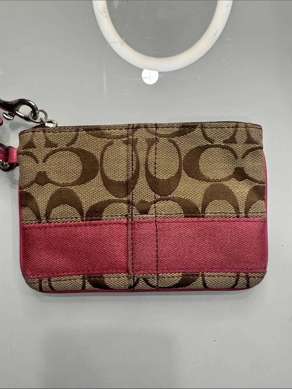 Coach signature wristlet with pink accents and hangtag